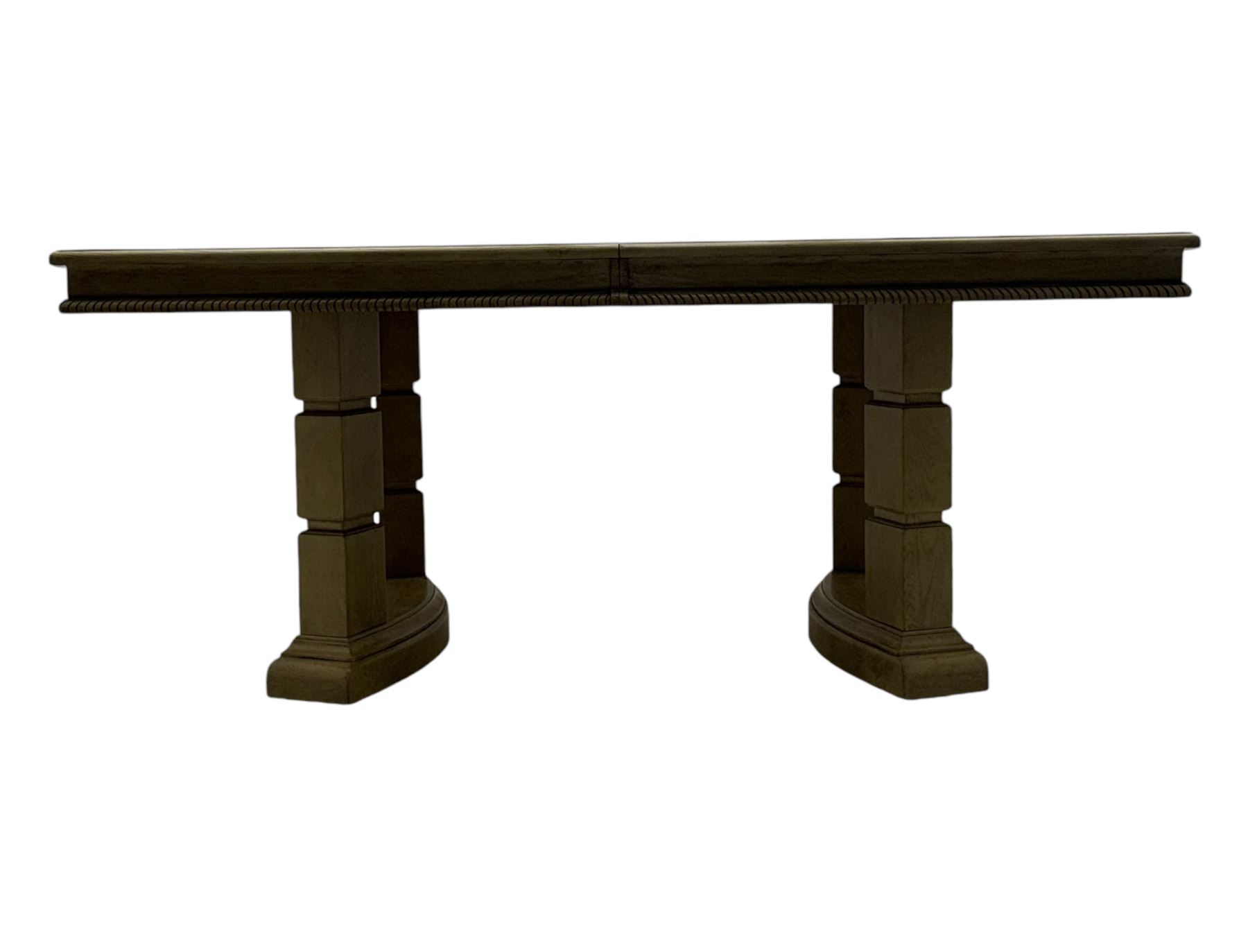 Brunswick - washed oak finish extending dining table, rectangular top with curved ends and carved frieze, central extension leaf, raised on twin pedestals with arched plinth bases and square-sectioned column supports; set of eight (6+2) high-back dining chairs upholstered in beige velvet fabric