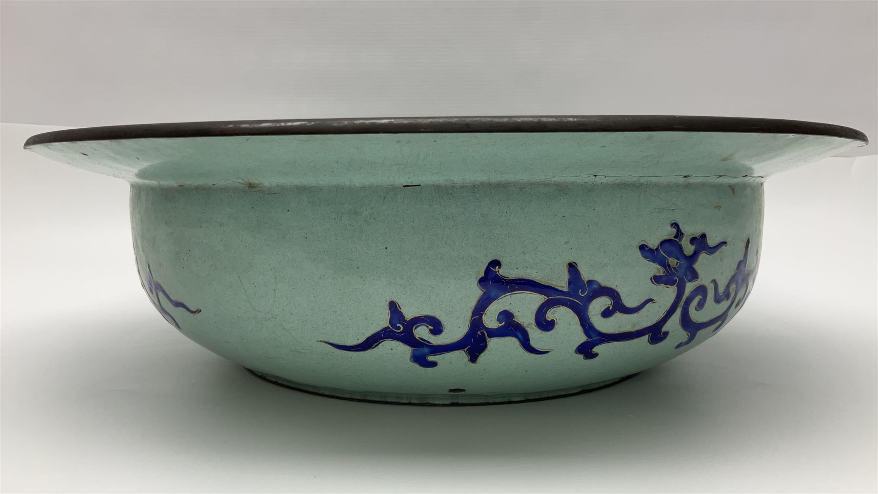 18th/19th century Chinese Canton enamel basin, the circular basin with flat everted rim, decorated with scrolling foliate and fruit decoration on a blue ground, D43cm
