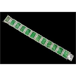 Art Deco platinum and white gold jadeite and diamond bracelet, twelve carved foliate jadeite panels, separated by a row of milgrain set old cut diamonds