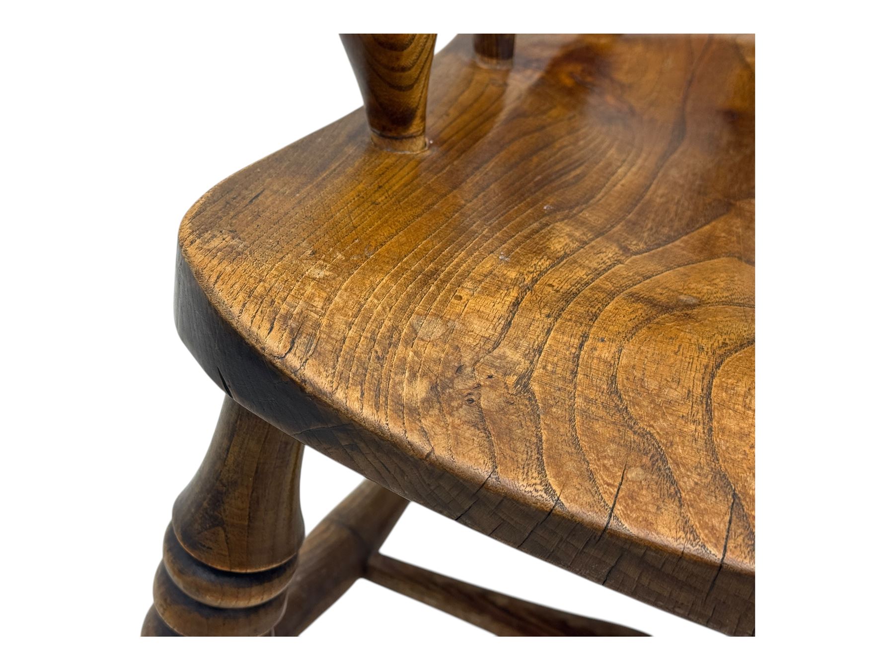 19th century elm and beech smoker's bow armchair, shaped arms over turned spindle gallery and dished seat, on turned supports united by double H-shaped swell turned stretchers 