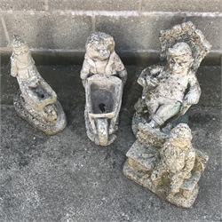 Two composite stone garden Gnomes, a hedgehog pushing a wheelbarrow and a man sat on a bench (4)