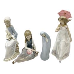 Four Lladro figures, comprising Afternoon Promenade no 7636, Nostalgia no 5071, both with original boxes, Girl with Lilies no 4972 and Madonna no 4534, largest example H27cm