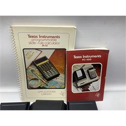 Four 1970s Sinclair electronic calculators - Cambridge in hard case with booklet; Scientific Programmable with Program Library and booklet; Scientific in hard case; and Oxford 300 in soft case with booklet; together with Texas PC-100 SR56 programmable slide-rule calculator on base station with readout, two booklets, keys and cover, serial no.9103093