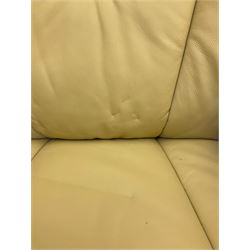 Reclining armchair upholstered in cream leather with stool 