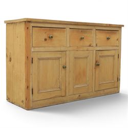 Victorian pine dresser base, with rectangular plank top, above three short drawers over tw...