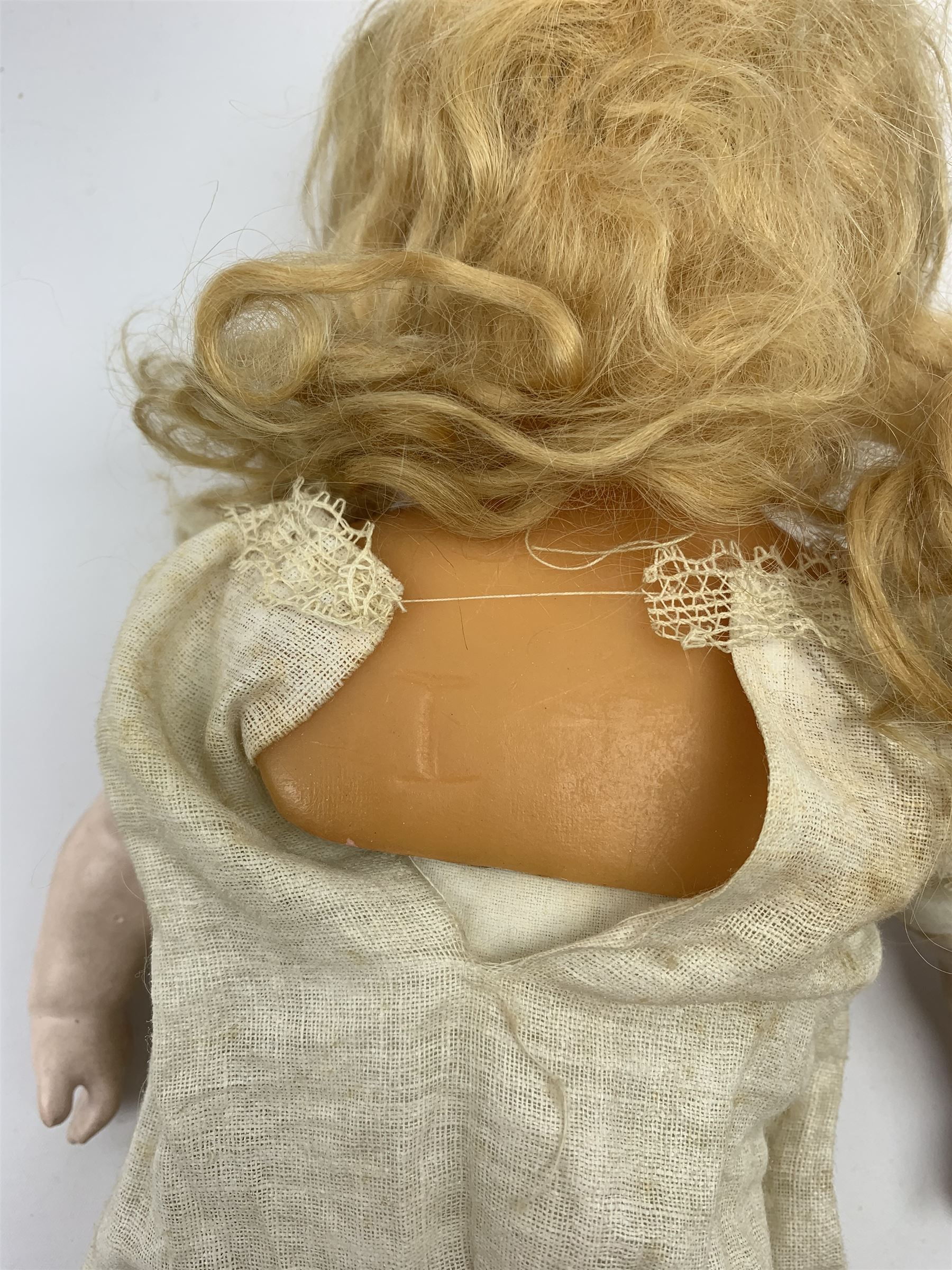 Early 20th century Cuno and Otto Dressel wax shoulder head doll with applied hair and fixed glass eyes, soft body with jointed composition lower limbs, maker's stamp to right thigh, clothing and box H38cm in original box