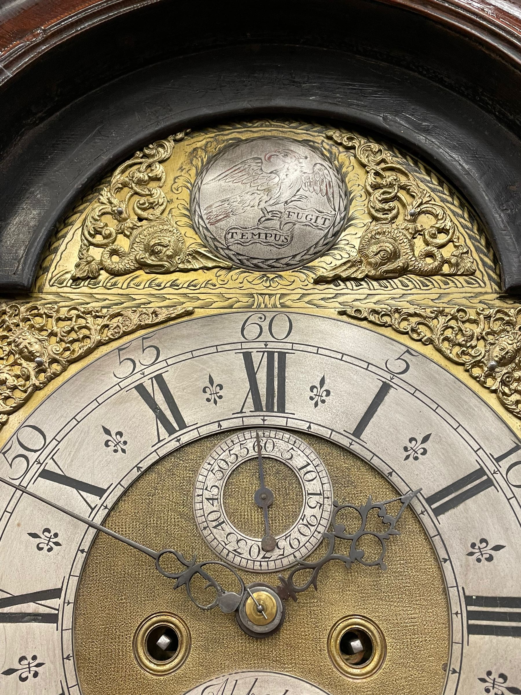 John Abbot of London – early 18th century walnut 8-day longcase clock c1740, hood with glazed side panels and tall swept pagoda pediment above a break arch hood door with attached pillars and gesso wooden capitals, long trunk door with a conforming break arch top on a rectangular plinth with applied shaped skirting, brass dial with a matted center and continuous herringbone engraving to the surround, cast spandrels, silvered chapter with Roman numerals, five minute Arabic’s, minute track and inner quarter hour track, subsidiary seconds dial and square date aperture, silvered tempus fugit boss to the break arch, dial pinned directly to a rack striking movement, striking the hours on a bell. With weights and pendulum.