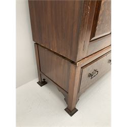 Large late Victorian walnut wardrobe, projecting cornice of central bevelled mirror and two panelled doors, two drawers to base