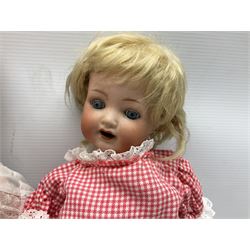 Heubach Koppelsdorf Germany bisque head doll with applied hair, sleeping eyes, open mouth with teeth and composition body with jointed limbs; marked 'Heubach Koppelsdorf 342.6/0 Germany' H34cm; Armand Marseille bisque head baby doll with moulded hair, sleeping eyes, open mouth and composition body with jointed limbs; marked 'A.M. Germany 351./8.K.; and BND London all composition doll (3)