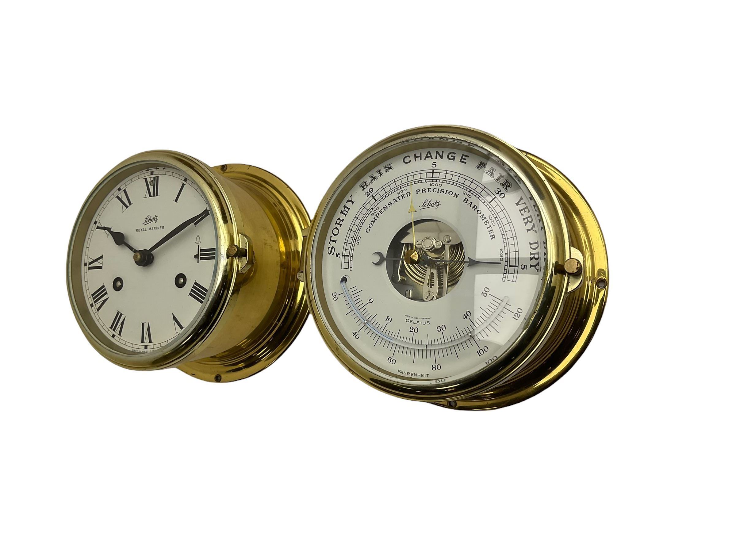 Eight-day 20th century brass cased “Schatz Royal Mariner” bulkhead clock, with a 6” dial, Roman numerals and minute track, bells on/off control, black spade hands with a brass bezel and flat bevelled glass, twin train spring driven balance wheel movement sounding the ships watches on a bell.
With a corresponding and matching Schatz open dial compensated aneroid barometer, with weather predictions and measuring barometric pressure in inches and millibars, with a curved spirit thermometer measuring temperature in Fahrenheit and Celsius, steel indicating hand and brass recording hand.

