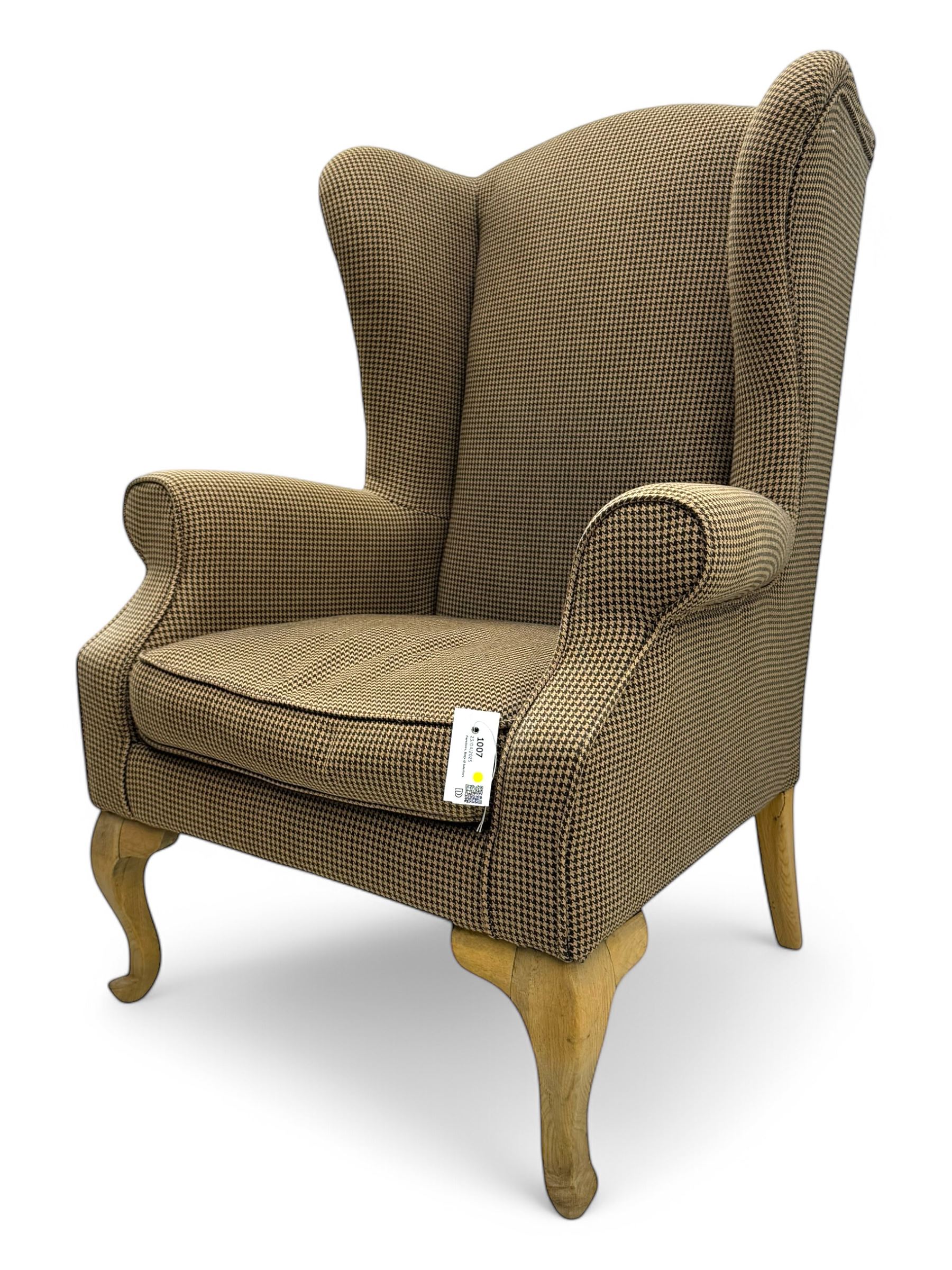 Hardwood-framed wingback armchair, upholstered in dog tooth pattern fabric, on cabriole supports 