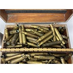 Large collection of shell and bullet casings, including a trench art example, together with a metal cartage case and wooden case