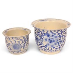 Graduating pair of jardinieres, decorated with peonies amongst foliage, largest H25cm, D32cm 
