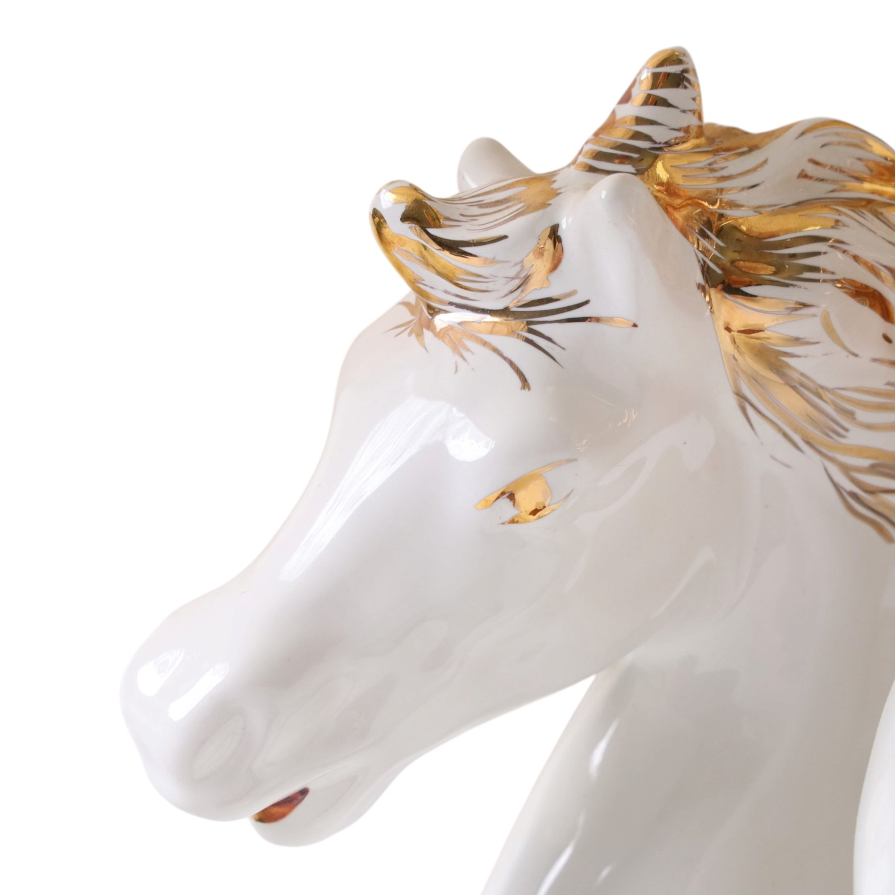Italian-style ceramic table-lamp featuring two white running horses with gold accents, with cream tasselled lampshade, upon a wooden base, approx. H60cm W40cm