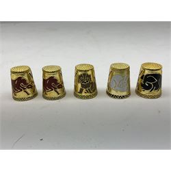 Twenty cloisonné thimbles, decorated with, flowers, birds, dragons, snakes, and other animals