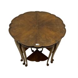 Mid 20th century figured walnut nest of tables, the centre table with shaped top and moulded edge on cabriole supports, with four nesting tables each with shaped undertier 