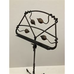 A wrought iron adjustable music stand, with tendril detail, H121.