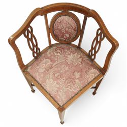 Edwardian inlaid mahogany corner chair, shaped cresting with satinwood band over interlaced splats, upholstered in floral pattern fabric, on square tapering supports with spade feet united by X-stretcher 