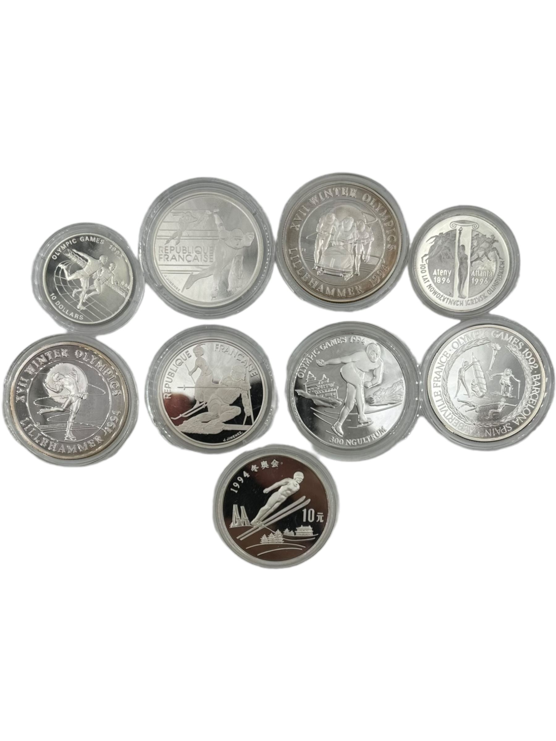 Twelve 'Olympic Commemorative' silver coins, including France 1990 'Slalom Skiing' one-hundred francs, China 1992 'Ski Jumper' ten yuan, Bhutan 1992 'Speed Skating' three-hundred ngultrums, Turks and Caicos Islands 1993 'Four-man Bobsleigh' twenty crowns etc, all with Westminster certificates