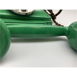 Jade green Bakelite telephone, of pyramid form with rotary alphabet dial, brown braided handset cord and a base draw, W18cm D14cm H15cm