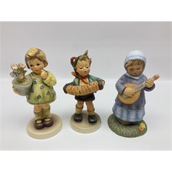 Thirty four Hummel figures by Goebel, to include Harmony & Lyric, Clean Bill of Health, Bird Watcher, An Apple a Day, Lamplight Caroler etc 