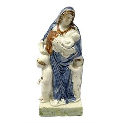 Late 18th century Prattware figure representing Charity, modelled as a mother with baby in her arms and two small children clutching at her robes, upon a square base, overall H21cm.