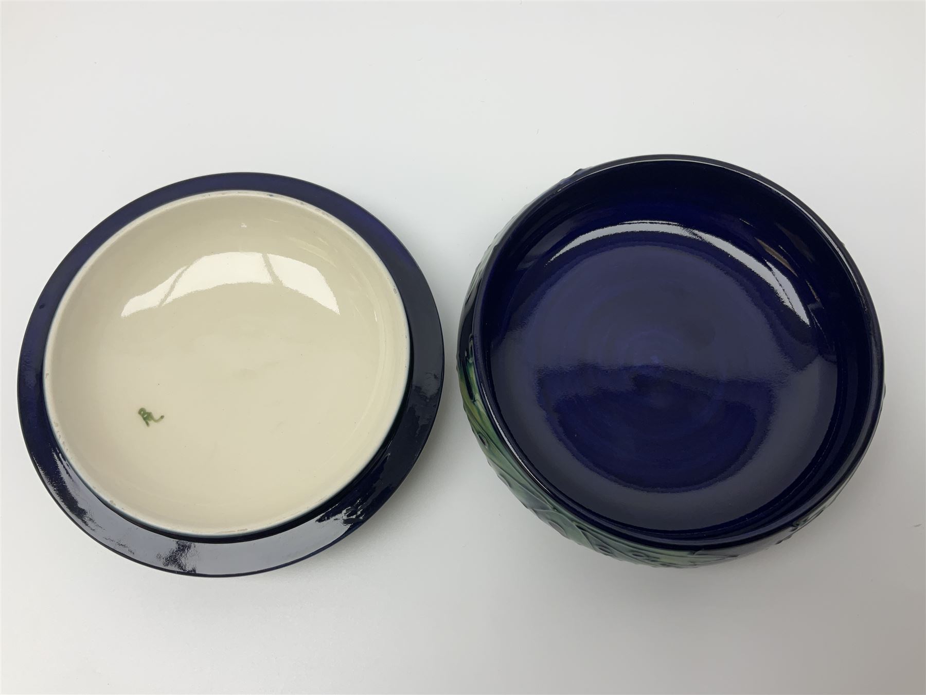 Moorcroft dish and cover, of circular form, decorated in Buttercup pattern, together with a Moorcroft vase, of baluster form, decorated in Magnolia pattern, both with printed marks beneath, tallest H9.5cm