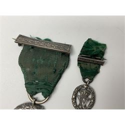 Victoria Volunteer Officers’ Decoration, V.R. cypher, hallmarked silver London 1892, with integral top riband bar and ribbon, unnamed; the matching miniature; and Victoria 'For Long Service in the Volunteer Force' miniature medal with ribbon in original case (3)