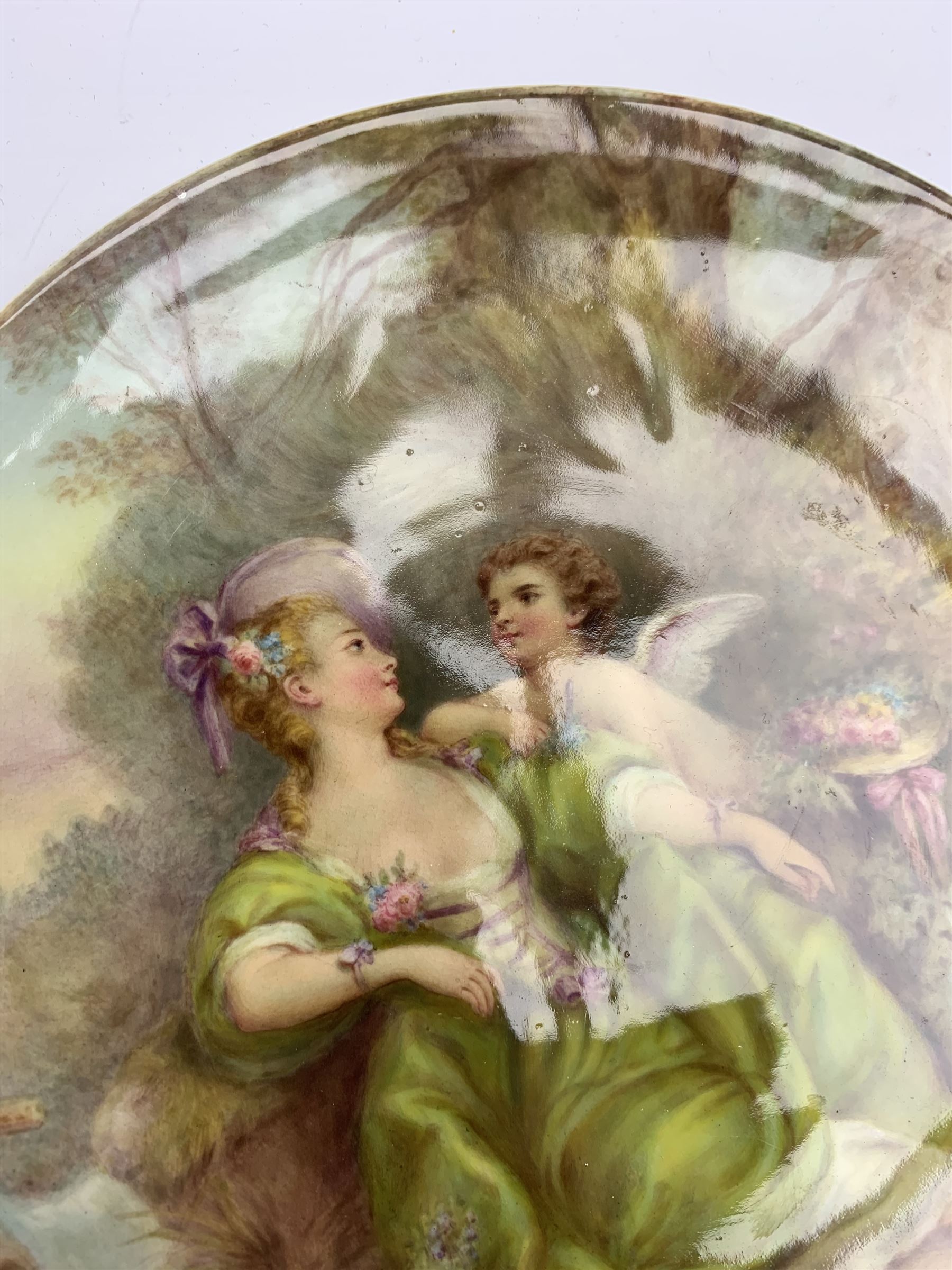 Late 19th century porcelain plate, hand painted by Frederick Sutton, depicting a female figure and putto within a wooded landscape, with recumbent sheep and brook to the fore, signed F N Sutton, unmarked verso, D22.5cm

Frederick Sutton was employed as a painter at the notable factories of Royal Worcester, Coalport, and Minton. 