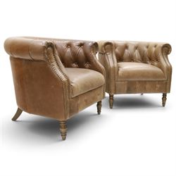 Alexander and James - pair of 'Jude' tub armchairs, traditional tub shape with buttoned back over deep seat, with studwork to the arm terminals, raised on turned front supports and splayed rear supports