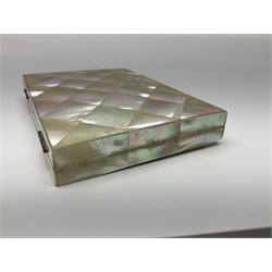 Victorian mother of pearl tea caddy, of rectangular bow-fronted form, the body with floral, bird and geometric engraved mother of pearl panels, white metal shield plaque to the cover inscribed with the initials G.J.A and similar escutcheon, the two division interior with ivory edging and two panelled mother of pearl lids, on four vegetable ivory bun feet L20cm, together with a similar style mother of pearl card case (2) This item has been registered for sale under Section 10 of the APHA Ivory Act