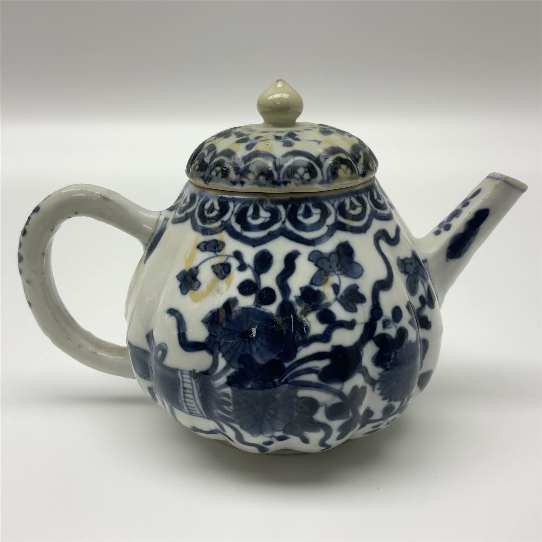 18th century Chinese blue and white teapot, painted with floral sprays, with lobed body and cover, H11cm