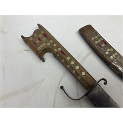 Late 19th/early 20th century Moroccan nimcha dagger-sword, the 40cm curving steel blade with engraved decoration on both sides; shaped hardwood hilt inlaid with brass, white metal wires and red coloured panels; in similarly inlaid scabbard L61cm overall