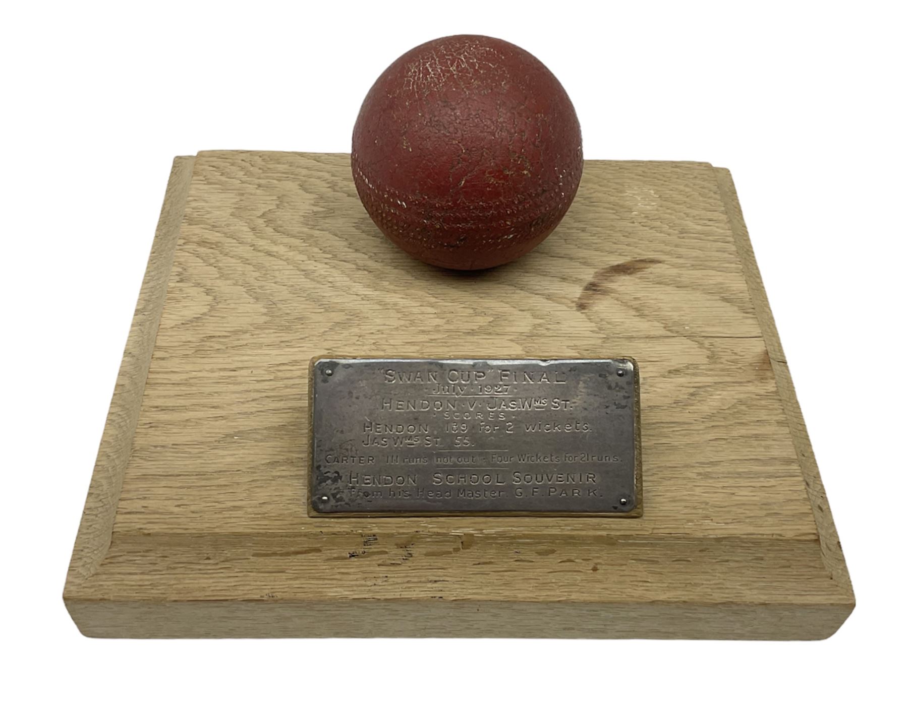 Raich Carter - early school cricket trophy of a cricket ball mounted on an oak base with white metal plaque inscribed 'Swan Cup Final/July 1927/Hendon v Jas.Wms.St/Scores/Hendon 189 for 2 wickets/Jas.Wms.St 55/Carter 111 runs (not out) Four wickets for 21 runs/Hendon School Souvenir/from his Head master G.F. Park' L20cm. Provenance: By direct descent from the family of Raich Carter having been consigned by his daughter Jane Carter.
