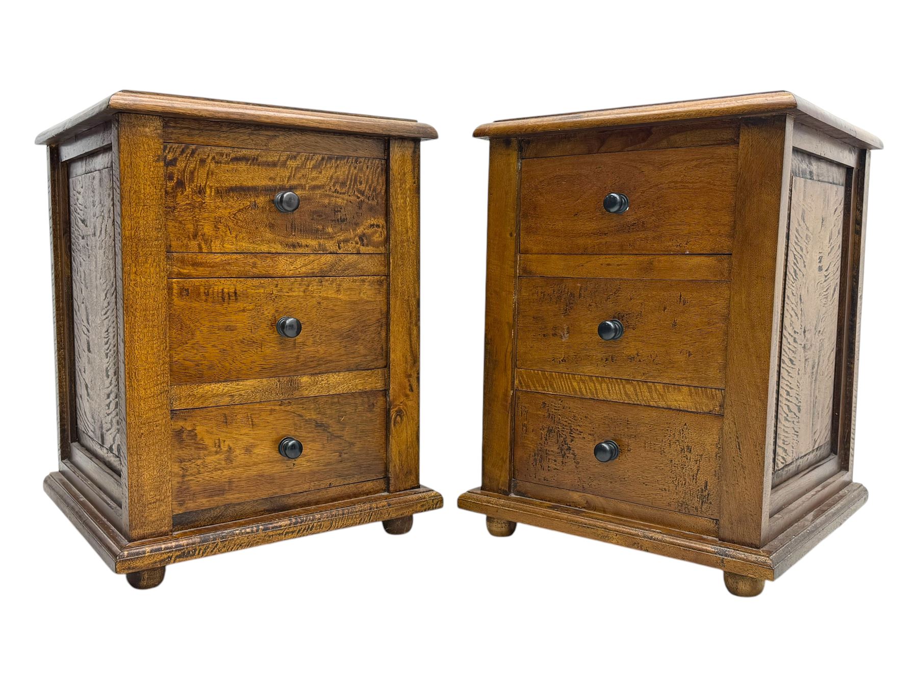 Pair of hardwood bedside chests, square tops with moulded edge, each fitted with three drawers flanked by square pilasters, raised on bun feet