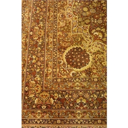  Persian Kashan design carpet, olive green ground, interlaced field with shaped medallion decorated with flowers and foliage, 360cm x 275cm  