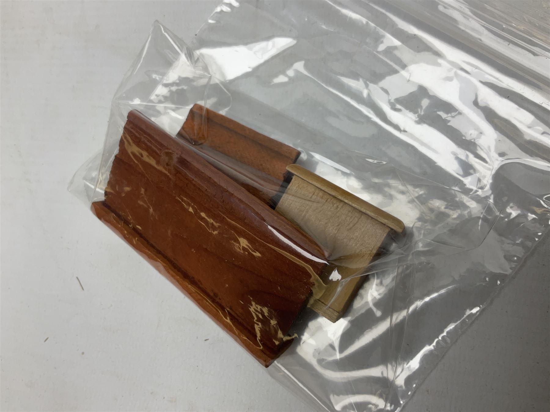 Doll's house wooden furniture - over twenty items including good quality pine Welsh dresser by Tony of Lincoln; tall 'glazed' bookcase; two-tier side cabinet; grand piano; bedside chest, mule chest, Canterbury; cradle; Georgian style hanging corner cupboard; dumb waiter; tables; chairs; rocking chair etc; various scales