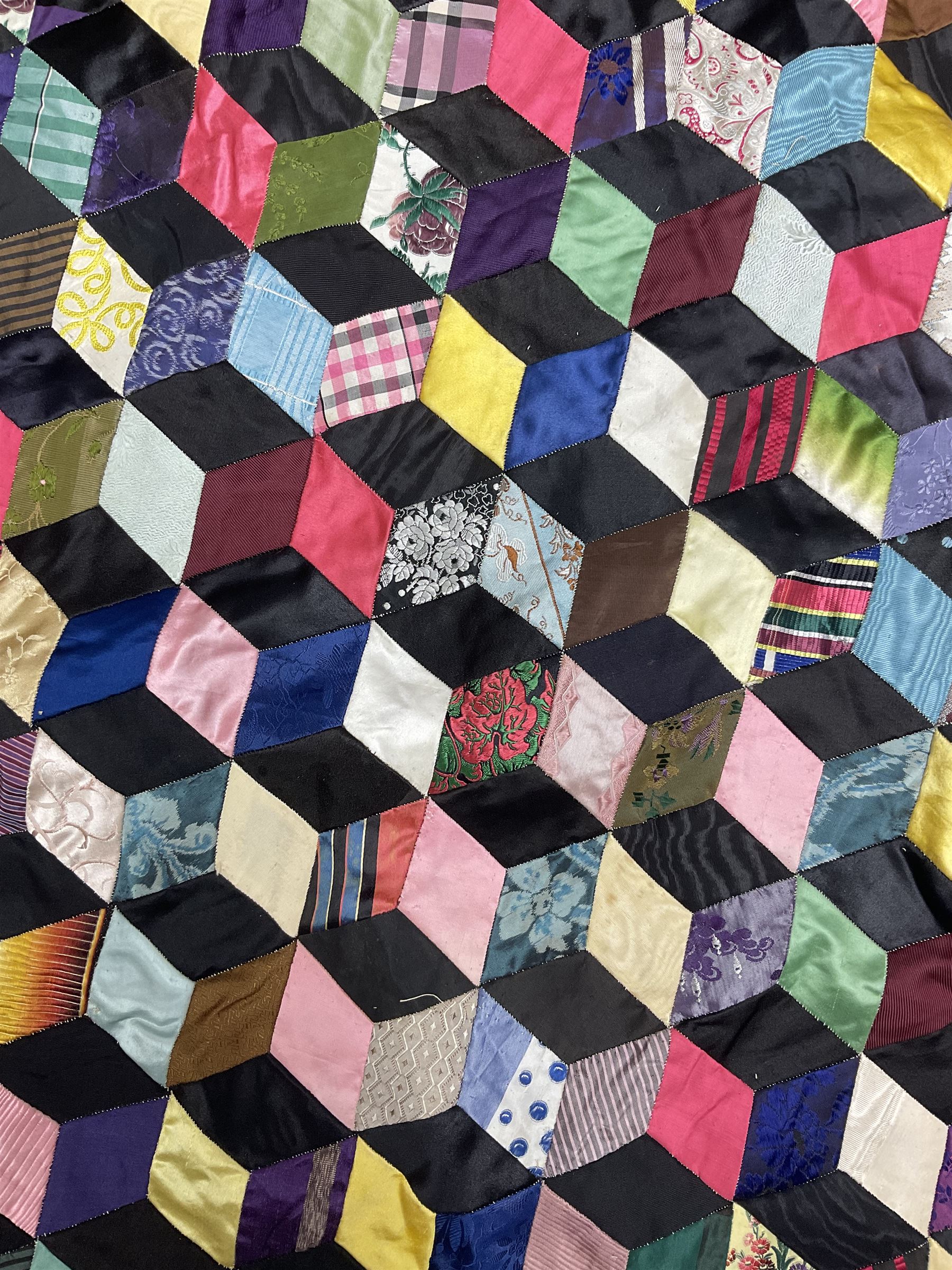 19th Century silk and satin tumbling blocks pattern patchwork quilt with black border 228cm X 196cm