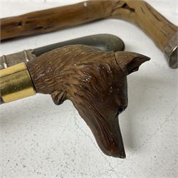 19th century painted bamboo walking cane, the handle carved as a fox with glass eyes, with gilt metal stamped LB, together with an ebonised wooden walking stick, with horn pommel and hallmarked silver collar and a curved wooden walking stick, with monogrammed white metal cap, tallest L90cm