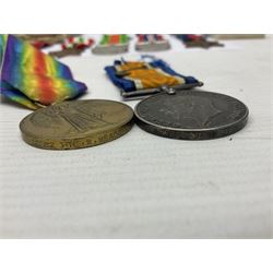 WWI pair of medals comprising British War Medal and Victory Medal awarded to 32682 Pte. W. Meadows W. Rid. R. in issue box; WWI pair of medals comprising 1914-15 Star and Victory Medal awarded to 3720 Pte. (later Cpl.) E. Petty W. York. R. with issue letter from Tank Corps; WWII group of five medals comprising 1939-45 War Medal, Defence Medal and 1939-45, Italy and Africa Stars; all with ribbons; and book of nineteen seaman's Certificates of Discharge to cook Charles Filburn 1893 - 1901 from various British ports