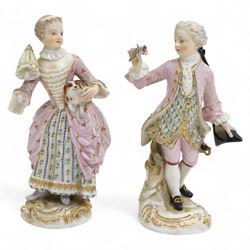 Pair of late 19th century Meissen figures, the male holding a rose and tricorn hat, the fe...