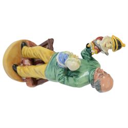 Four Royal Doulton figures, comprising The Judge HN2443, The Lawyer HN3041, Punch and Judy Man HN2765 and HN2016 