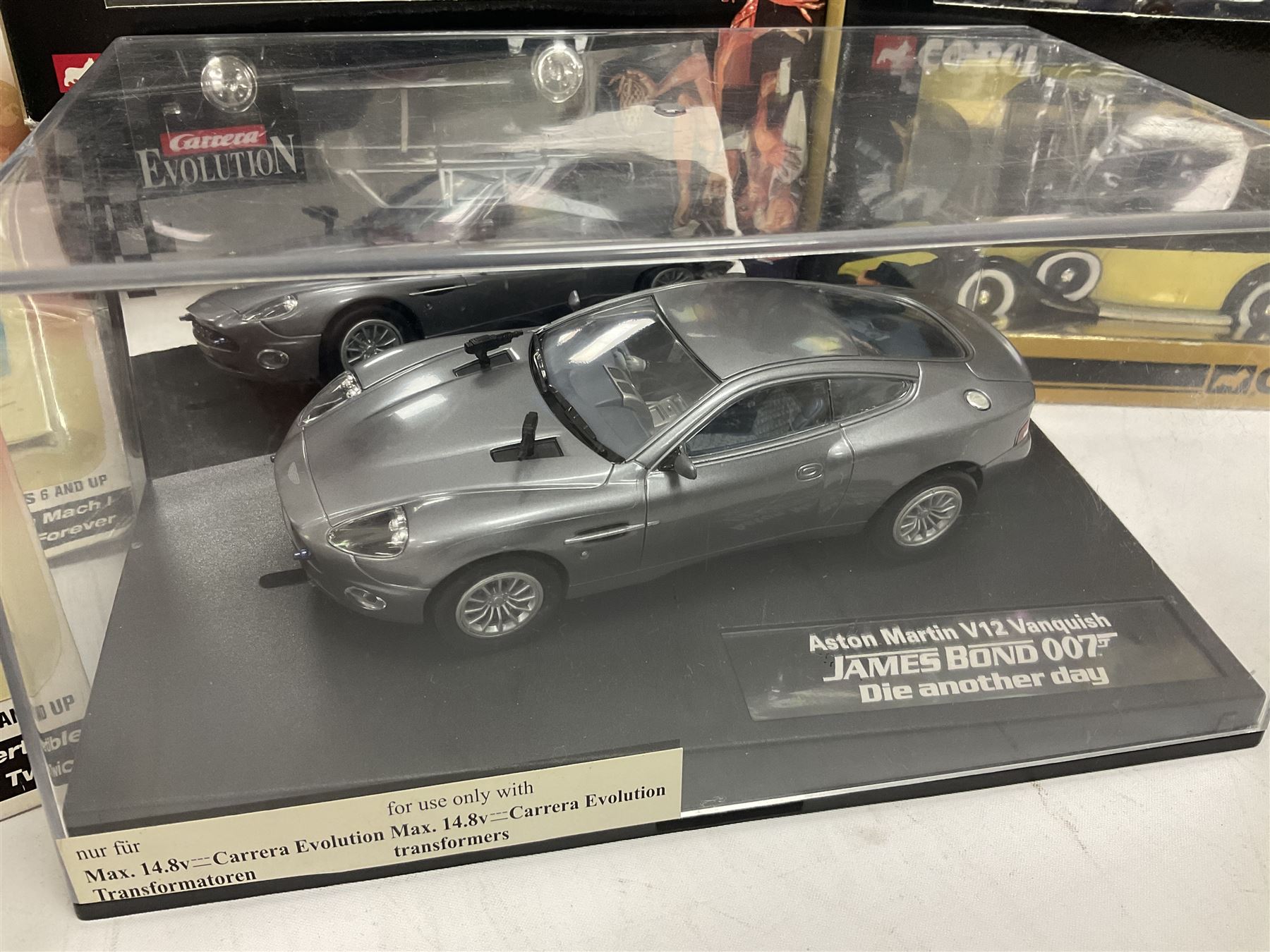 Corgi - The Definitive Bond Collection and The Director's Cut - nine die-cast vehicles from You Only Live Twice, Goldfinger, For Your Eyes Only, Diamonds Are Forever etc; Corgi Classics Moonraker Shuttle and Lotus Esprit; two other Corgi James Bond packs; Carrera Die Another Day Aston Martin V12 Vanquish; nine Johnny Lightning carded James Bond vehicles; Dragon carded Wai Lin figure; and three Fabbri tanks; all boxed/packaged (27)