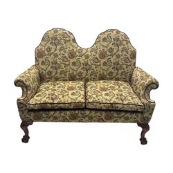 Mid-20th century William and Mary design two-seat sofa, upholstered in floral patterned fabric with contrasting piping, featuring camel-shaped back and scroll arms, on cabriole supports