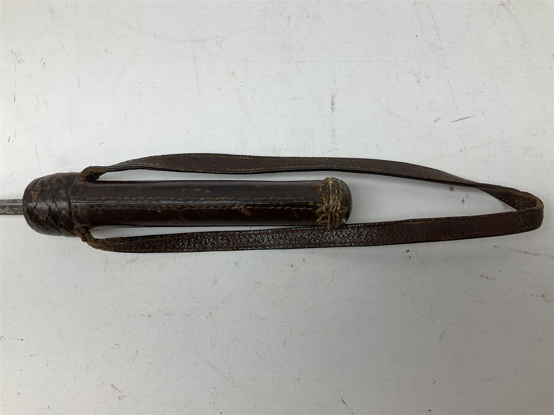 Early 20th century officer's swagger type leather covered sword stick, the 33cm etched single fullered blade marked Wilkinson Pall Mall, with carrying strap L60.5cm