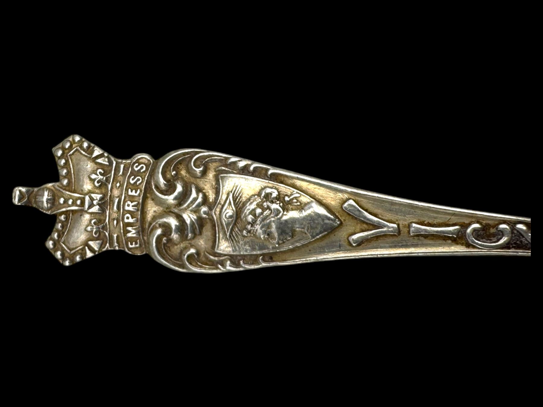 Three silver decanter labels and a collection of silver and silver plated cutlery