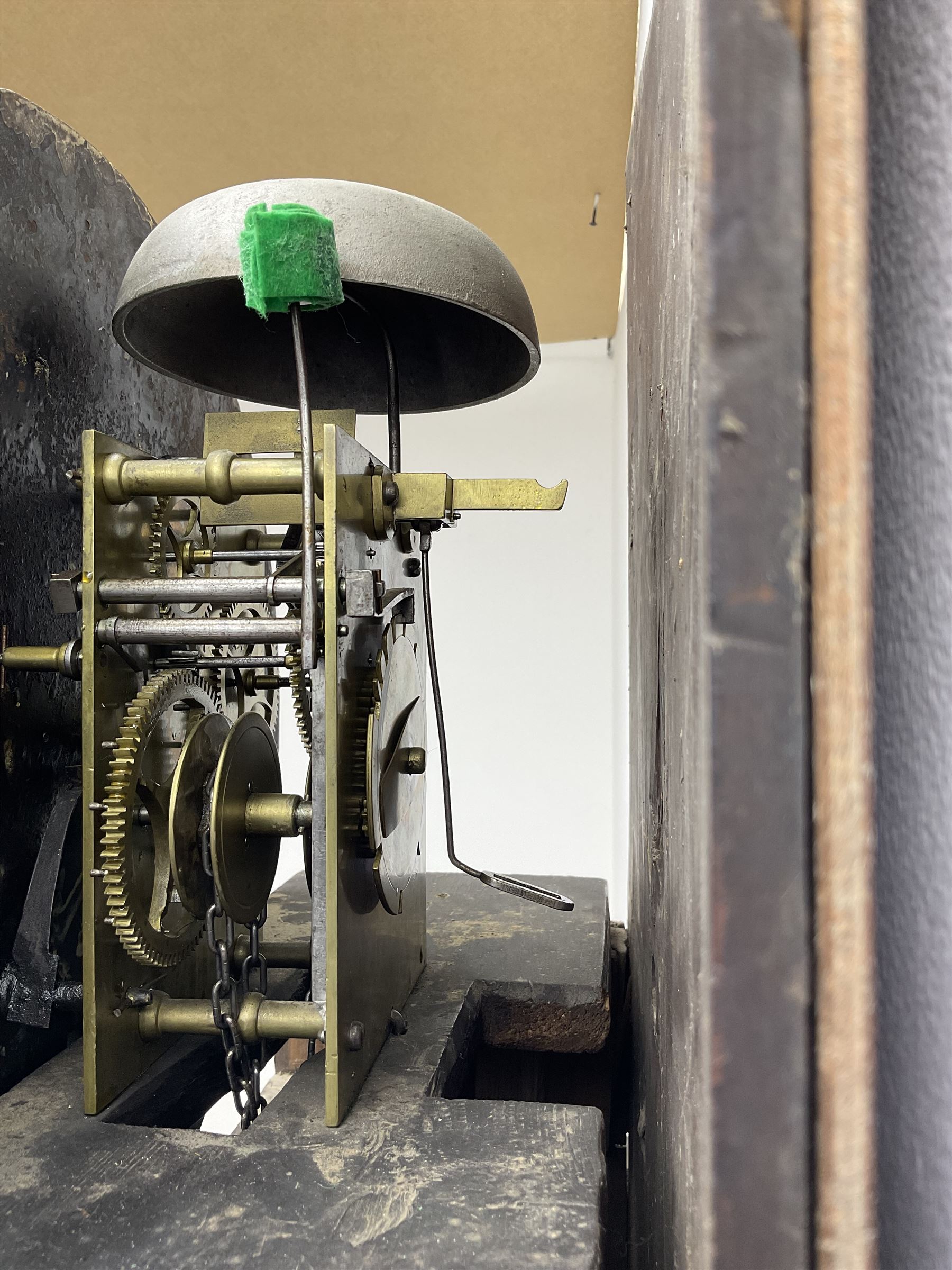 Henry Fisher of Preston (Lancs) -  late 18th century 30-hour oak and mahogany longcase clock c1790, with a flat topped pediment and moulded cornice, square hood door flanked by two plain pillars with brass capitals, trunk with recessed quarter columns, three-quarter length trunk door with an ogee twin spire top and crossbanding, rectangular plinth with canted corners and a narrow applied moulding to the base, circular 13” painted dial with Roman numerals, minute markers and five minute Arabic's, floral decoration to the centre and a semi-circular calendar aperture with date disc behind, original steel serpentine hands, dial inscribed “H Fisher, Preston”, dial pinned directly to a weight driven countwheel striking movement, striking the hours on a cast bell. With pendulum and weight.
Henry Fisher is recorded as working in Preston from 1742-95.
