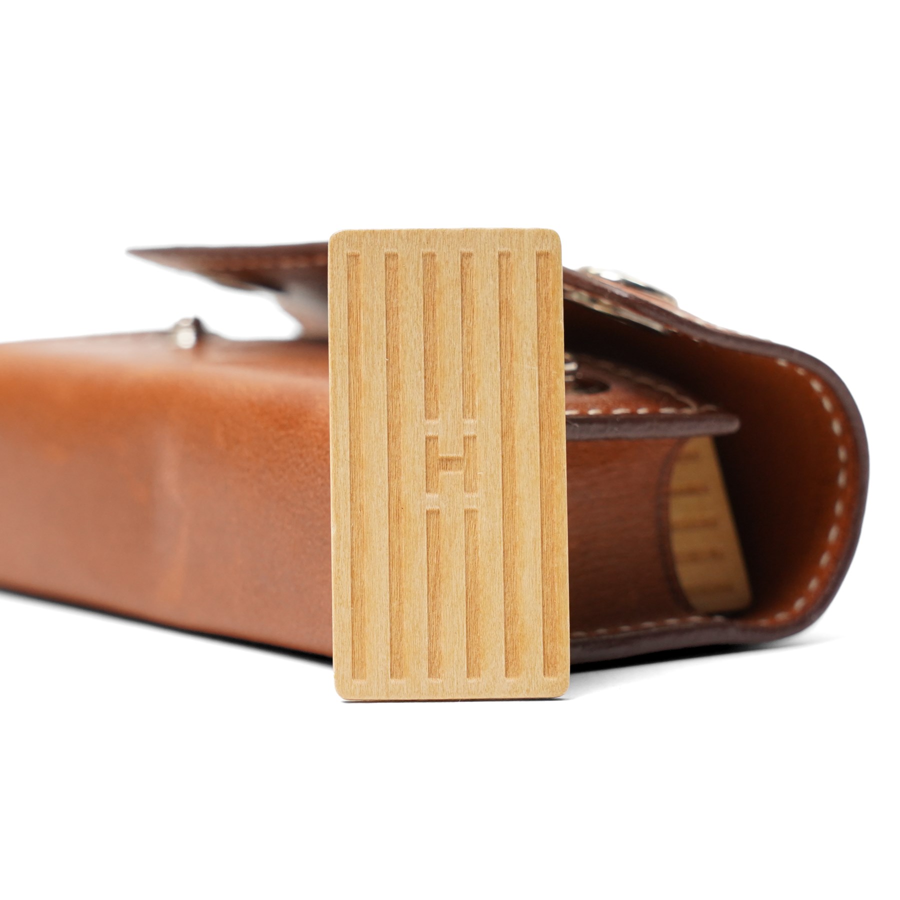 Hermès - ‘Mini-Dominos In-the-Pocket’ game, comprising miniature domino set in tan leather press-stud case, with original box and booklet