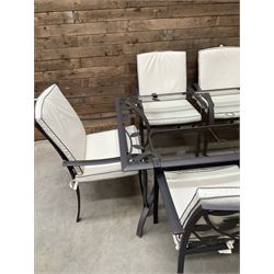 Metal framed garden table with glazed top (W170cm, D102cm, H71cm) and six armchairs with cushions 