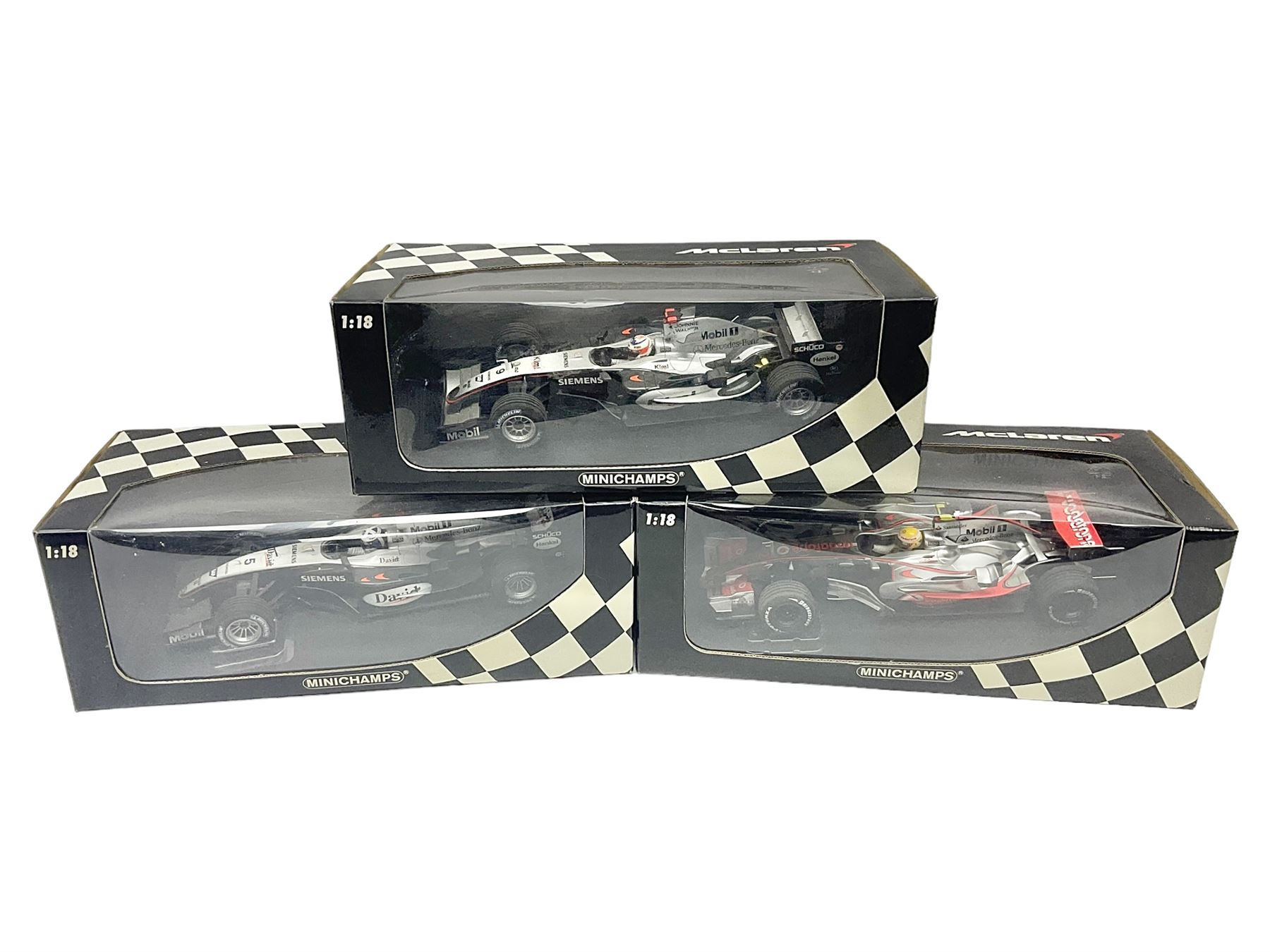 Three Minichamps 1:18 scale die-cast McLaren racing cars - Mercedes MP4-19 D. Coulthard; Mercedes MP4-20 K. Raikkonen; and Vodaphone Mercedes MP4-22 L. Hamilton 2007; all boxed (3)

